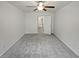 A bedroom with light grey carpet, ceiling fan and white paint at 3513 Lakeview Crk, Lithonia, GA 30038