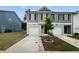 Charming townhome featuring a one-car garage and a well-maintained front yard at 3513 Lakeview Crk, Lithonia, GA 30038