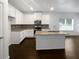 Bright kitchen with white cabinets, granite countertops, and stainless steel appliances at 3513 Lakeview Crk, Lithonia, GA 30038
