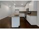 Modern kitchen featuring an island with a sink, granite countertops, and stainless steel appliances at 3513 Lakeview Crk, Lithonia, GA 30038