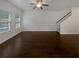 Spacious living room boasts beautiful hardwood floors and ample natural light at 3513 Lakeview Crk, Lithonia, GA 30038