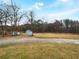 Spacious backyard with storage shed, mature trees, and a large grassy area at 118 Mann Blvd, Stockbridge, GA 30281