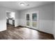 Dining area with french doors to the yard adjacent to kitchen with stainless steel appliances at 118 Mann Blvd, Stockbridge, GA 30281
