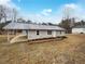 Charming single-story home featuring a carport and freshly landscaped front yard at 118 Mann Blvd, Stockbridge, GA 30281