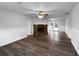 Spacious living room featuring hardwood floors, a stone fireplace, and natural light at 118 Mann Blvd, Stockbridge, GA 30281