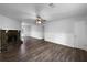 Spacious living room with a stone fireplace, ceiling fan, and hardwood floors at 118 Mann Blvd, Stockbridge, GA 30281