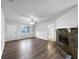 Bright living room with a stone fireplace and hardwood floors, featuring a ceiling fan at 118 Mann Blvd, Stockbridge, GA 30281