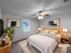Staged bedroom with neutral decor, ceiling fan, and large window at 118 Mann Blvd, Stockbridge, GA 30281