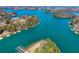 Gorgeous aerial view of the lake community with private docks and lush green surroundings at 6219 Woodlake Dr, Buford, GA 30518