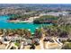 Stunning aerial view of lakefront community with private boat docks and lush surrounding trees at 6219 Woodlake Dr, Buford, GA 30518