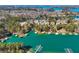 Aerial view of a community situated along the lakefront, with boat docks and waterfront access at 6219 Woodlake Dr, Buford, GA 30518