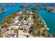 Panoramic view showcasing homes, piers, lake, and winding roads of a waterfront neighborhood at 6219 Woodlake Dr, Buford, GA 30518