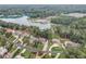 Scenic view of community near the lake with beautiful homes and mature trees at 6219 Woodlake Dr, Buford, GA 30518