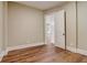 Neutral bedroom featuring hardwood floors and bright white trim at 6219 Woodlake Dr, Buford, GA 30518
