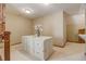 Walk-in closet with a custom island featuring drawers, shelving and rustic door access at 6219 Woodlake Dr, Buford, GA 30518