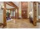 Grand foyer featuring hardwood floors, wood trim, and custom millwork at 6219 Woodlake Dr, Buford, GA 30518