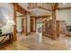 Spacious foyer with hardwood floors, natural lighting and a staircase leading upstairs at 6219 Woodlake Dr, Buford, GA 30518
