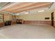 Spacious three-car garage with epoxy floor and recessed lights at 6219 Woodlake Dr, Buford, GA 30518