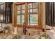 Kitchen sink featuring granite countertops and a view of nature outside the window at 6219 Woodlake Dr, Buford, GA 30518