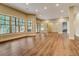 Expansive living room boasts hardwood floors, natural light, and views at 6219 Woodlake Dr, Buford, GA 30518