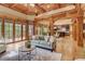 Bright living room with access to the balcony and a view of the gourmet kitchen at 6219 Woodlake Dr, Buford, GA 30518