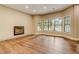 Spacious living room with hardwood floors, fireplace and abundant natural light at 6219 Woodlake Dr, Buford, GA 30518