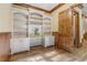 Office space with custom built-ins, a desk, a reading nook, and hardwood floors at 6219 Woodlake Dr, Buford, GA 30518