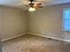Large bedroom with ceiling fan and neutral walls at 46 Leland Sw Dr, Mableton, GA 30126