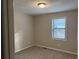 Well-lit bedroom, neutral walls, and carpet flooring at 46 Leland Sw Dr, Mableton, GA 30126
