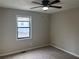 Spacious bedroom with neutral walls and ceiling fan at 46 Leland Sw Dr, Mableton, GA 30126