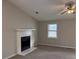 Living room featuring a fireplace and large windows at 46 Leland Sw Dr, Mableton, GA 30126