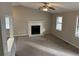 Spacious living room with fireplace and ceiling fan at 46 Leland Sw Dr, Mableton, GA 30126
