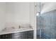 Bathroom showcasing a marble countertop, dark cabinets, and a glass-enclosed shower at 225 River Valley Lot 5 Ct, Atlanta, GA 30328