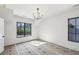 Bedroom featuring neutral walls and a window offering natural light and a neighborhood view at 225 River Valley Lot 5 Ct, Atlanta, GA 30328