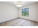 Cozy bedroom with a large window offering a scenic view of the outdoors and natural light at 225 River Valley Lot 5 Ct, Atlanta, GA 30328