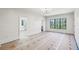 Large room featuring shiplap walls and a window offering a view of the green surroundings at 225 River Valley Lot 5 Ct, Atlanta, GA 30328