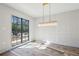 Dining room featuring a modern chandelier and large window with beautiful natural light at 225 River Valley Lot 5 Ct, Atlanta, GA 30328