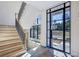 Bright entryway featuring an elegant staircase and large windows providing ample natural light at 225 River Valley Lot 5 Ct, Atlanta, GA 30328