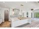 Bright kitchen features a large island, stainless steel appliances, custom cabinets, and an archway entrance at 225 River Valley Lot 5 Ct, Atlanta, GA 30328