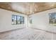 Spacious living room featuring herringbone wood ceiling, white walls, and black windows at 225 River Valley Lot 5 Ct, Atlanta, GA 30328