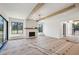 Bright living room showcasing a fireplace and large windows offering ample natural light at 225 River Valley Lot 5 Ct, Atlanta, GA 30328