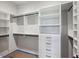 Walk-in closet with custom shelves and built-in drawers for optimal storage at 225 River Valley Lot 5 Ct, Atlanta, GA 30328
