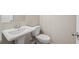 Bathroom with a pedestal sink, large mirror, and modern fixtures at 88 Black Gum Ln # 43, Auburn, GA 30011