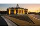 A stately municipal complex at twilight, featuring manicured landscaping and elegant architectural design at 88 Black Gum Ln # 43, Auburn, GA 30011