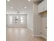 Bright living room featuring hardwood floors, recessed lighting, and large windows for ample natural light at 88 Black Gum Ln # 43, Auburn, GA 30011