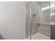 Bathroom featuring a glass shower with neutral colored tiling at 88 Black Gum Ln # 43, Auburn, GA 30011