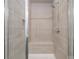 Bathroom featuring a shower with a built-in bench and tiled walls at 88 Black Gum Ln # 43, Auburn, GA 30011