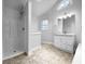 Bathroom featuring shower, vanity, and skylight for ample natural light at 130 Ashley Oaks Dr, Mcdonough, GA 30253