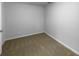 A neutral-colored carpeted bedroom features white walls and baseboards with a single electrical outlet at 130 Ashley Oaks Dr, Mcdonough, GA 30253