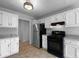 Bright kitchen with white cabinets and stainless-steel appliances is perfect for meal preparation at 130 Ashley Oaks Dr, Mcdonough, GA 30253